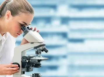 Scientist with a microscope