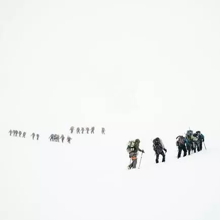 Teams climbing a mountain