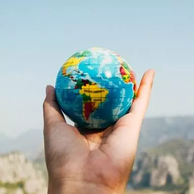 Globe being held