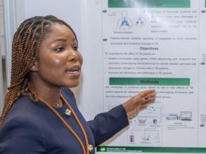 Millicent presenting her poster at the at the VALIDATE Annual Meeting 2025
