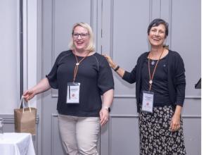 Nastassja (left), winning the best poster award at the VALIDATE Annual Meeting 2025